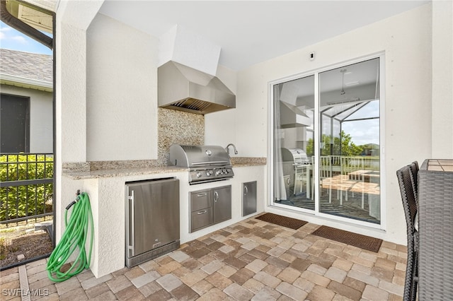 17672 Silverspur Dr, Punta Gorda, FL 33982 - view of patio / terrace featuring exterior kitchen