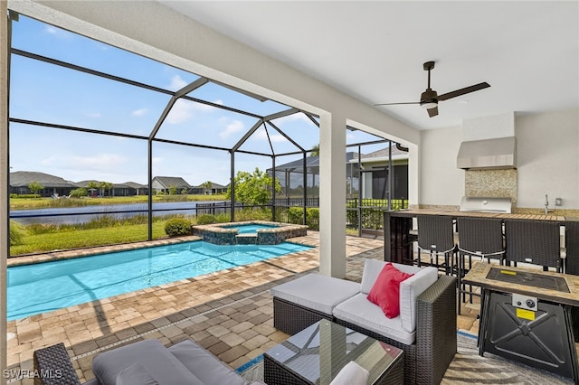 17672 Silverspur Dr, Punta Gorda, FL 33982 - view of pool with an outdoor bar, a water view, glass enclosure, a patio, and a pool with connected hot tub
