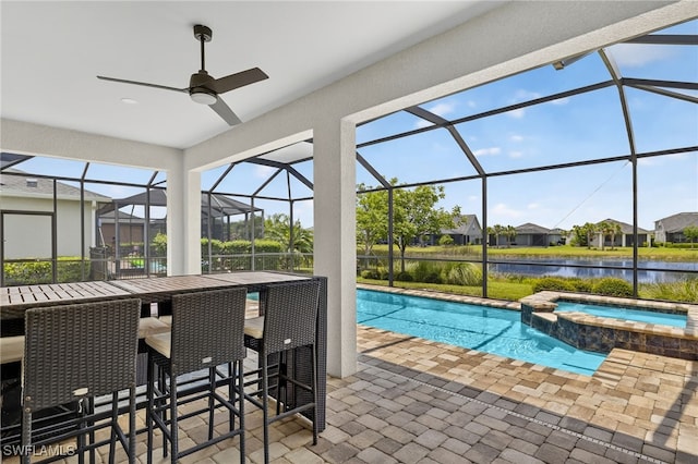 17672 Silverspur Dr, Punta Gorda, FL 33982 - view of pool featuring a water view, a patio, a pool with connected hot tub, and a lanai