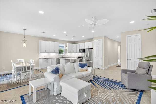 17672 Silverspur Dr, Punta Gorda, FL 33982 - living room featuring light tile patterned floors, ceiling fan, and recessed lighting