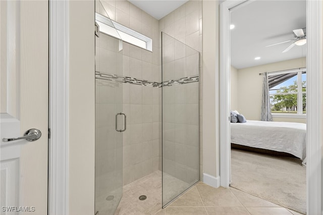 17672 Silverspur Dr, Punta Gorda, FL 33982 - bathroom with ensuite bathroom, a shower stall, ceiling fan, and tile patterned floors