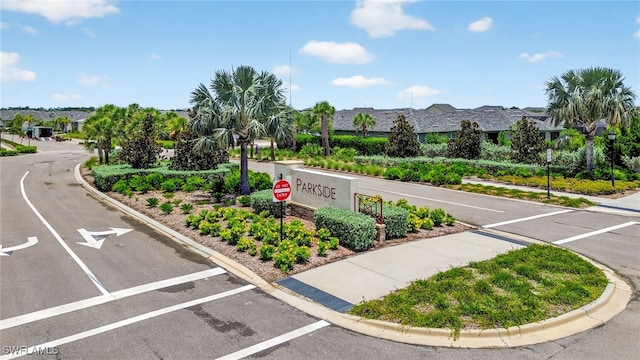 17672 Silverspur Dr, Punta Gorda, FL 33982 - view of asphalt road featuring traffic signs, curbs, and a residential view
