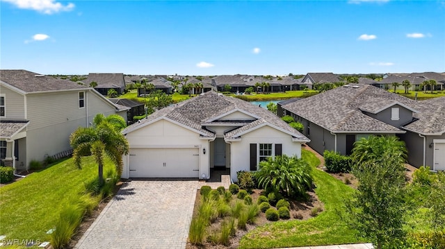 17672 Silverspur Dr, Punta Gorda, FL 33982 - ranch-style home featuring a residential view, an attached garage, decorative driveway, and stucco siding