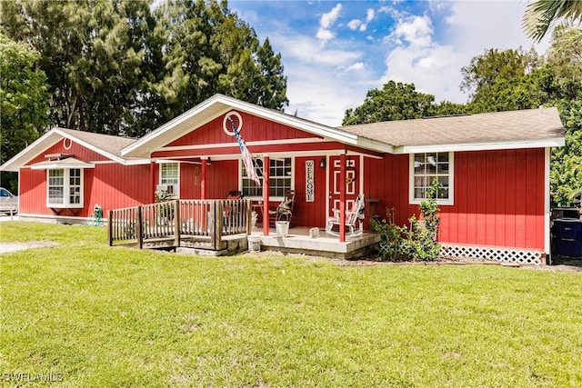 245 Hubbard Ave, North Fort Myers, FL 33917 - ranch-style house featuring a porch, a front yard, and roof with shingles