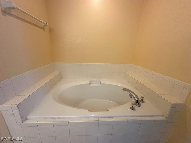 bathroom with a garden tub