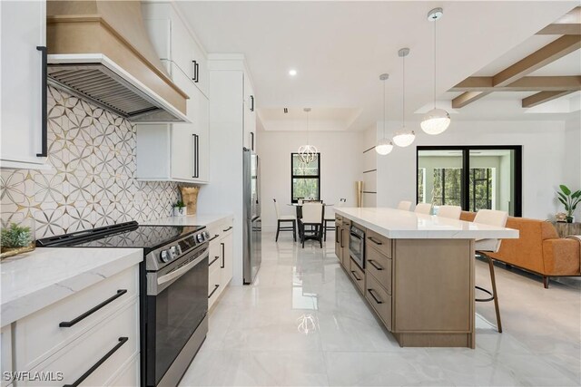 24131 Cock Robin Ln, Bonita Springs, FL 34135 - kitchen with appliances with stainless steel finishes, custom exhaust hood, tasteful backsplash, a breakfast bar area, and a center island