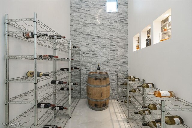 24131 Cock Robin Ln, Bonita Springs, FL 34135 - wine room featuring a towering ceiling