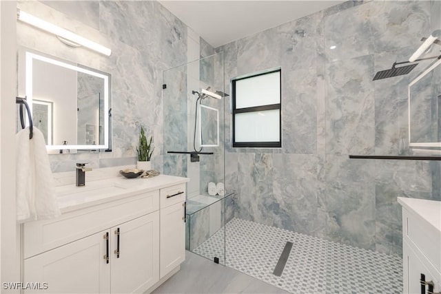 24131 Cock Robin Ln, Bonita Springs, FL 34135 - bathroom with vanity, a marble finish shower, and tile walls
