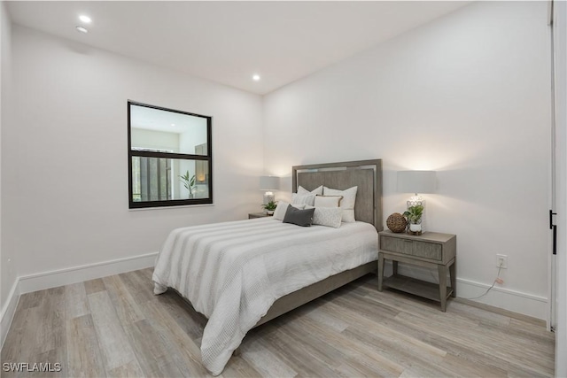 24131 Cock Robin Ln, Bonita Springs, FL 34135 - bedroom with light wood-style flooring, baseboards, and recessed lighting