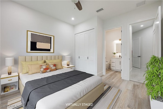 24131 Cock Robin Ln, Bonita Springs, FL 34135 - bedroom featuring light wood-style floors, a closet, connected bathroom, recessed lighting, and baseboards