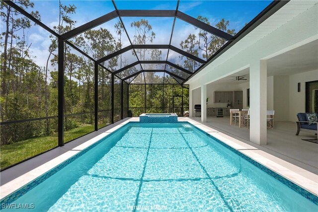 24131 Cock Robin Ln, Bonita Springs, FL 34135 - view of swimming pool with a patio area, ceiling fan, a pool with connected hot tub, and a lanai