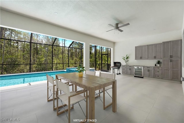 24131 Cock Robin Ln, Bonita Springs, FL 34135 - dining area featuring beverage cooler and a ceiling fan