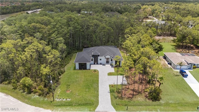 24131 Cock Robin Ln, Bonita Springs, FL 34135 - view of subject property with a forest