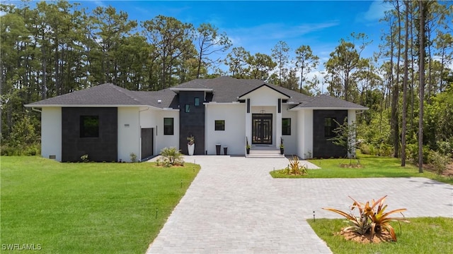 24131 Cock Robin Ln, Bonita Springs, FL 34135 - view of front of house with stucco siding and a front yard