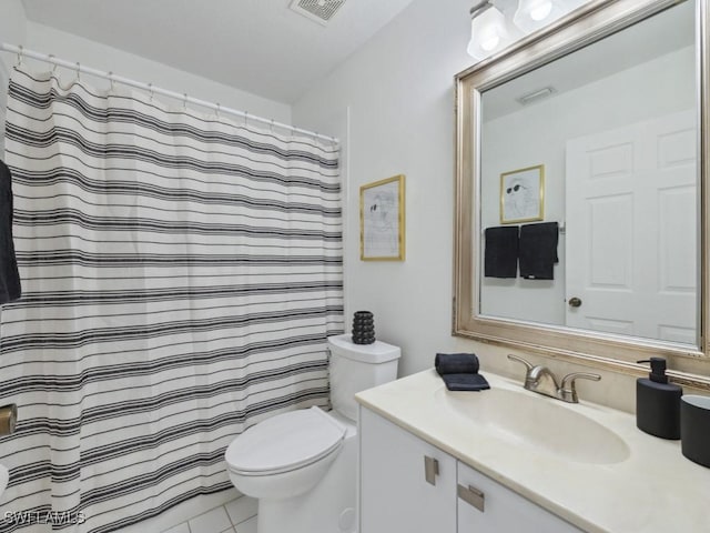 bathroom with toilet, vanity, a shower with shower curtain, and tile patterned floors