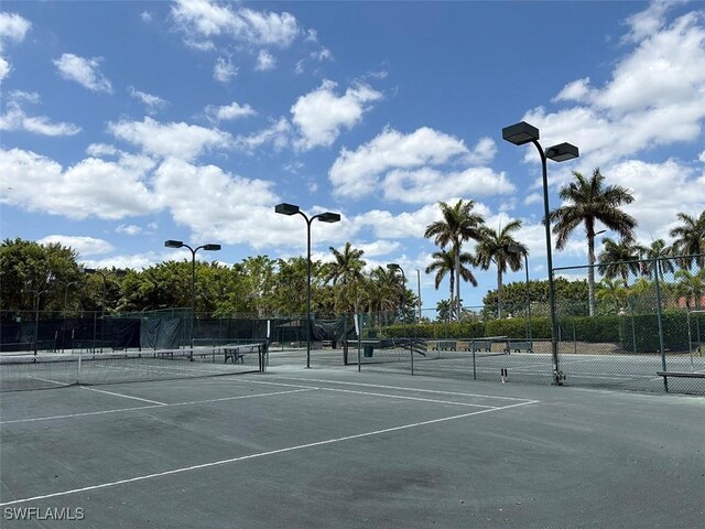 view of tennis court with fence