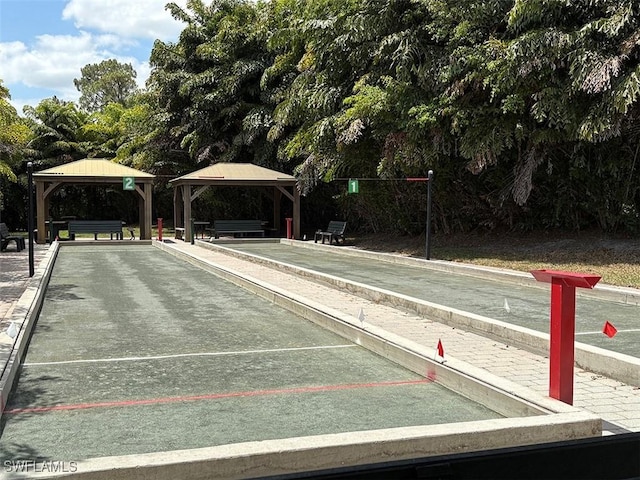 view of community featuring a game area and a gazebo