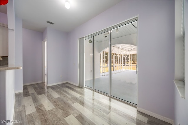 1083 Pollywog Dr, Labelle, FL 33935 - unfurnished room featuring wood finished floors and baseboards