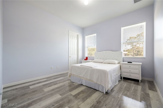 1083 Pollywog Dr, Labelle, FL 33935 - bedroom with baseboards and light wood-style flooring