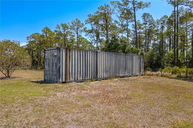 1083 Pollywog Dr, Labelle, FL 33935 - view of grassy yard with an outbuilding
