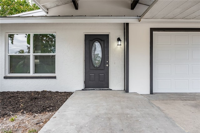 5863 Millay Ct, North Fort Myers, FL 33903 - view of exterior entry featuring stucco siding