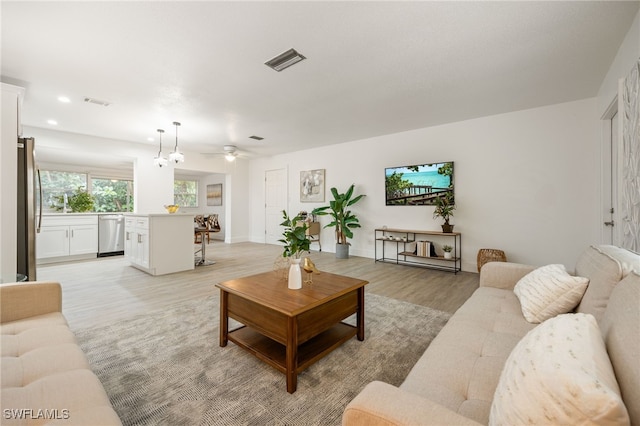 5863 Millay Ct, North Fort Myers, FL 33903 - living room featuring light wood-style flooring, a ceiling fan, and recessed lighting
