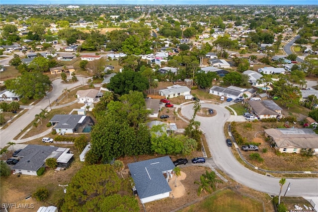 5863 Millay Ct, North Fort Myers, FL 33903 - aerial view of property and surrounding area with nearby suburban area