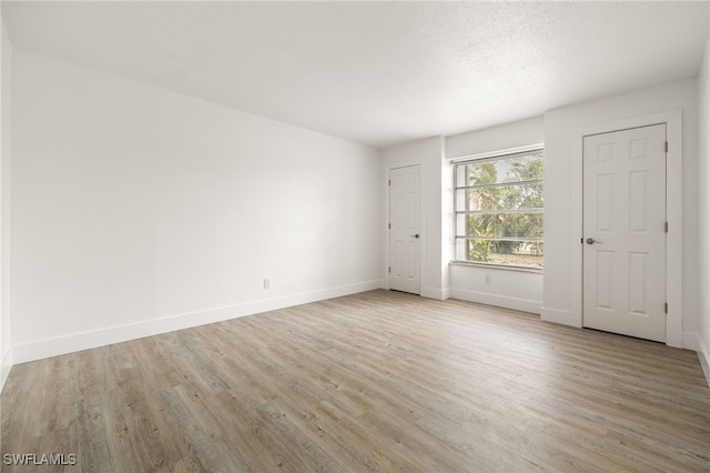 5863 Millay Ct, North Fort Myers, FL 33903 - spare room with light wood-type flooring and baseboards
