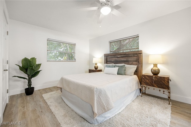 5863 Millay Ct, North Fort Myers, FL 33903 - bedroom featuring wood finished floors, baseboards, and a ceiling fan