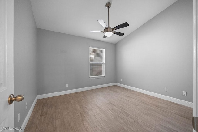 1429 Monarch Cir, Naples, FL 34116 - spare room featuring a ceiling fan, wood finished floors, vaulted ceiling, and baseboards