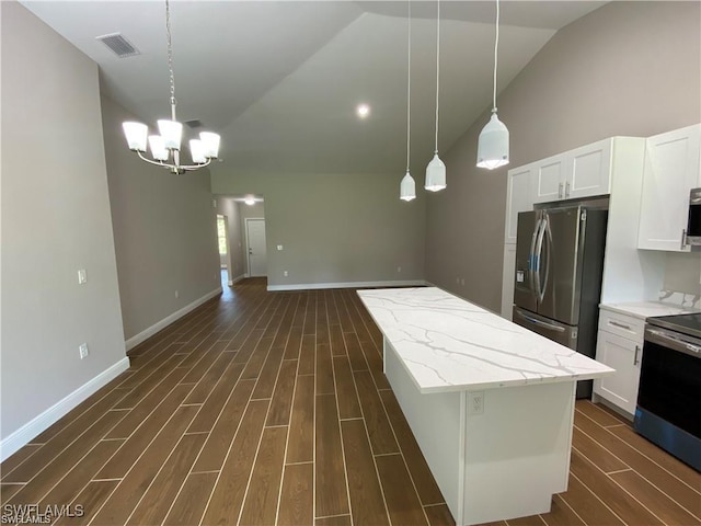 5115 30th St SW, Lehigh Acres, FL 33973 - kitchen featuring stainless steel appliances, lofted ceiling, dark wood finished floors, a chandelier, and a center island