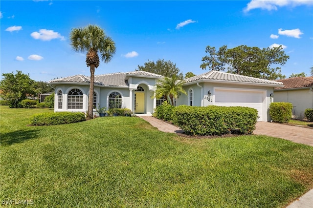 3932 Ruxton Rd, Naples, FL 34116 - mediterranean / spanish-style house featuring a tile roof, a garage, a front yard, stucco siding, and driveway