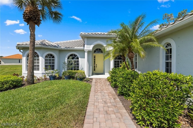 3932 Ruxton Rd, Naples, FL 34116 - mediterranean / spanish home featuring stucco siding and a front yard