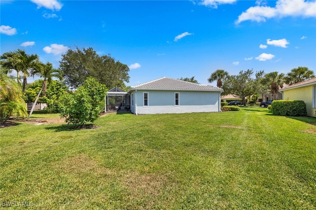 3932 Ruxton Rd, Naples, FL 34116 - view of grassy yard with glass enclosure