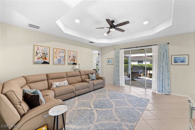 3932 Ruxton Rd, Naples, FL 34116 - living room with a ceiling fan, a raised ceiling, baseboards, light tile patterned floors, and recessed lighting