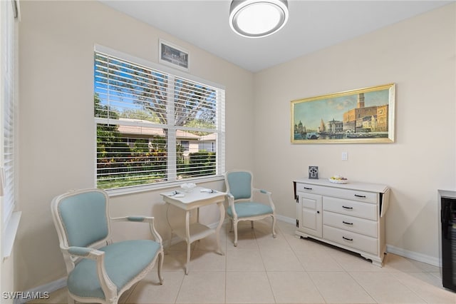 3932 Ruxton Rd, Naples, FL 34116 - sitting room with baseboards and light tile patterned floors