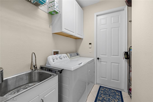 3932 Ruxton Rd, Naples, FL 34116 - laundry area featuring cabinet space, washer and dryer, and light tile patterned flooring