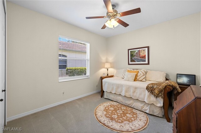3932 Ruxton Rd, Naples, FL 34116 - bedroom featuring light carpet, baseboards, and ceiling fan