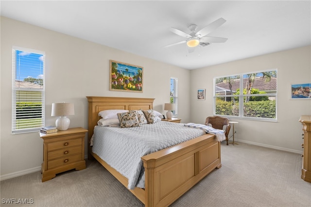 3932 Ruxton Rd, Naples, FL 34116 - bedroom featuring light colored carpet, baseboards, and ceiling fan