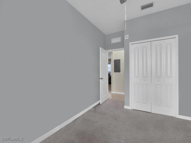 5651 Double Eagle Cir Unit 4342, Ave Maria, FL 34142 - unfurnished bedroom with electric panel, carpet flooring, a closet, and baseboards