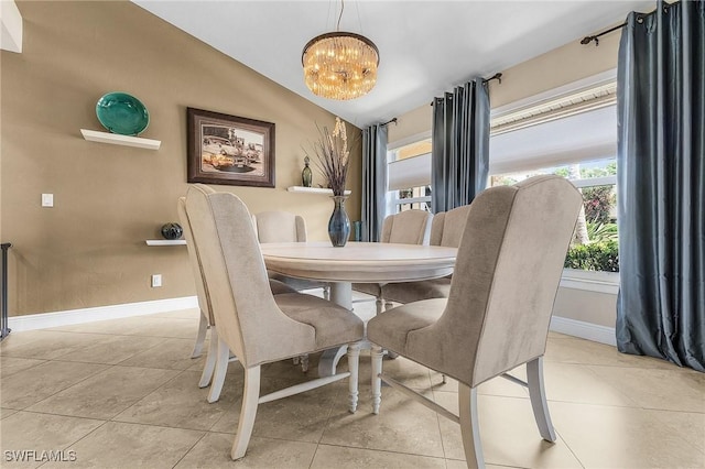 813 Saint Andrews Blvd, Naples, FL 34113 - tiled dining area with a chandelier, baseboards, and vaulted ceiling
