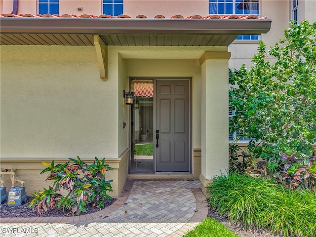 11256 Bienvenida Way Unit 6D, Fort Myers, FL 33908 - property entrance with stucco siding and a tile roof