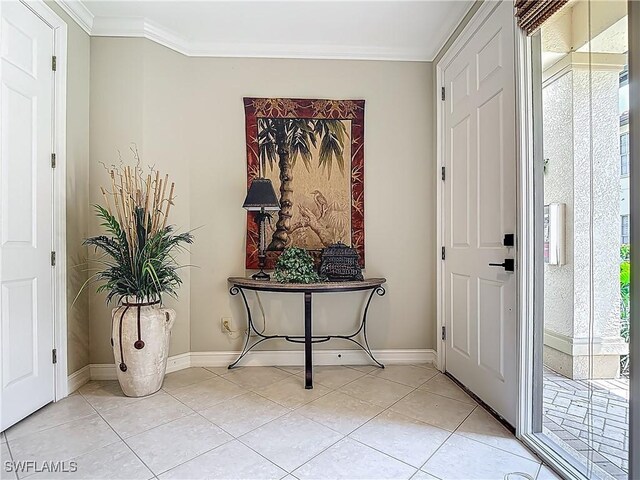 11256 Bienvenida Way Unit 6D, Fort Myers, FL 33908 - entryway with ornamental molding, light tile patterned floors, and baseboards