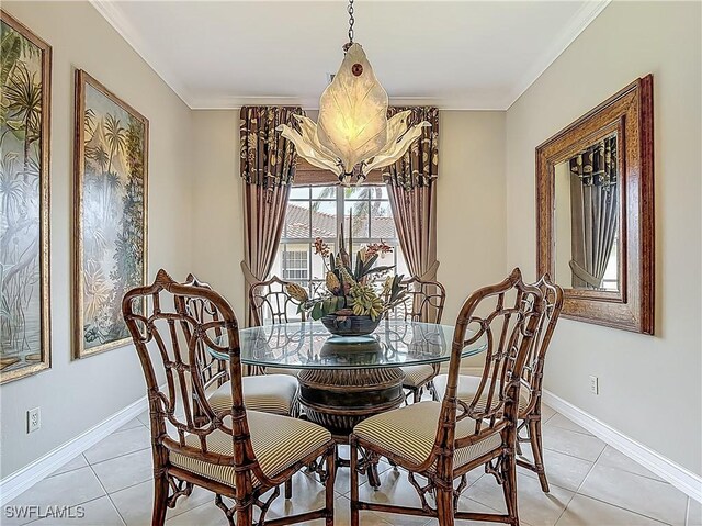 11256 Bienvenida Way Unit 6D, Fort Myers, FL 33908 - dining room featuring light tile patterned floors, baseboards, and crown molding