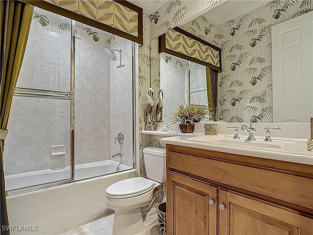 11256 Bienvenida Way Unit 6D, Fort Myers, FL 33908 - bathroom featuring wallpapered walls, toilet, bath / shower combo with glass door, and vanity