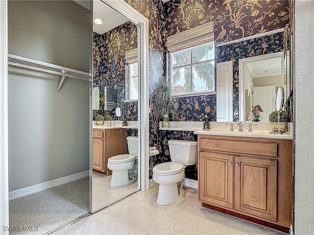 11256 Bienvenida Way Unit 6D, Fort Myers, FL 33908 - full bath with wallpapered walls, toilet, vanity, baseboards, and a spacious closet