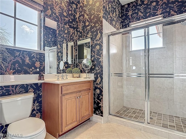 11256 Bienvenida Way Unit 6D, Fort Myers, FL 33908 - bathroom with wallpapered walls, a stall shower, tile patterned flooring, vanity, and toilet