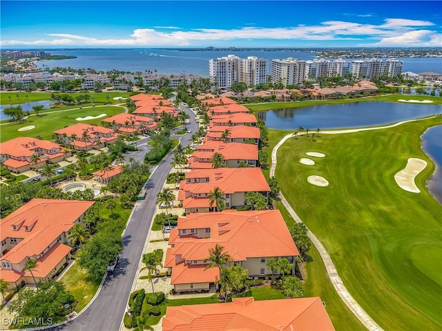 11256 Bienvenida Way Unit 6D, Fort Myers, FL 33908 - drone / aerial view of a nearby body of water, a golf course, and apartment complex / building