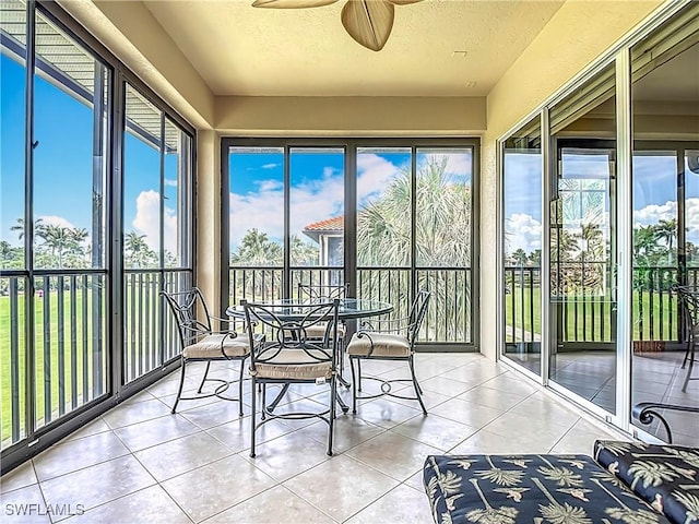 11256 Bienvenida Way Unit 6D, Fort Myers, FL 33908 - sunroom / solarium with tile patterned floors, plenty of natural light, and a textured ceiling