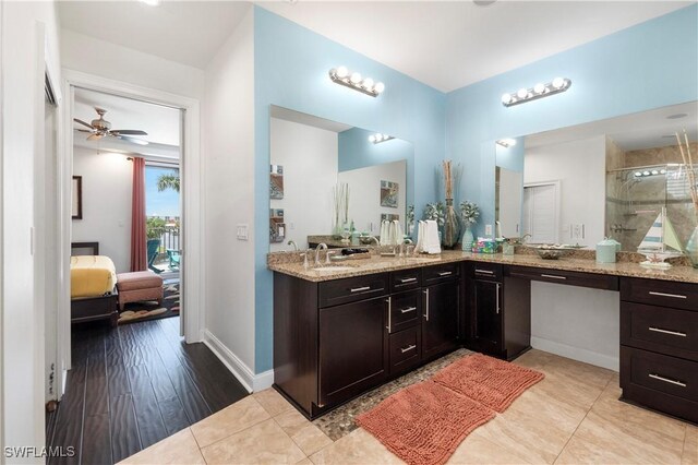 5105 Rutland Ct, Cape Coral, FL 33904 - ensuite bathroom featuring vanity, baseboards, an enclosed shower, and ceiling fan
